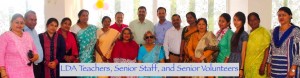 A group of Indian adults, some in traditional dress