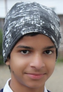 Closeup of young Indian boy wearing a head scarf